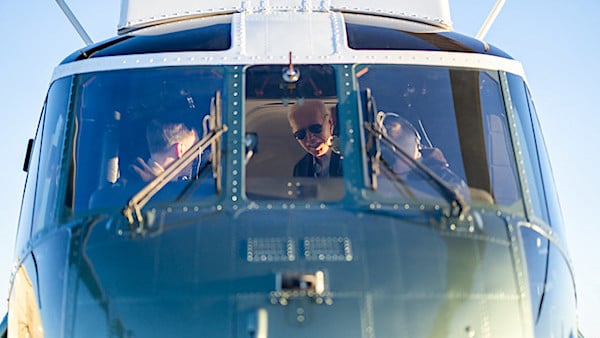 Joe Biden greets the pilots of Marine One before a flight back to Rehoboth, Delaware, Sunday, Jan. 21, 2024. (Official White House photo by Adam Schultz)